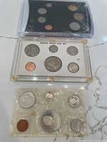 All three Canadian coin sets shown together