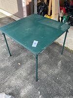Overall view of green folding card table set up