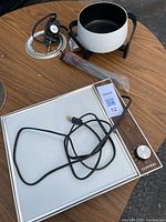 Corning cooktop, West Bend fondue pot, stand, probe and forks displayed on table