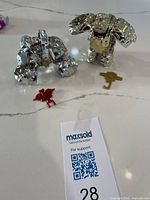 Both chrome Rock Lords figures in robot mode with weapons