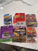Group shot of all six unopened die-cast cars