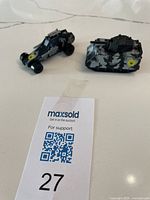 Overview of both vehicles with lot card