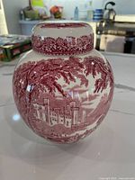 Front view showing full jar, castle scene and lid