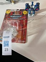 Blister card and action figure shown together