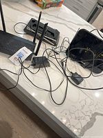 Overall view of router, two Philips antennas and cabling on countertop