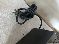 Attached grounded AC power cord