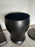 Barrel-shaped metal wastebasket