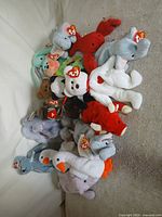 Overview of pile of Beanie Babies on sofa