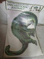 Front view of kit with header card and apatosaurus cutout visible