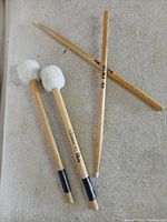 All four sticks laid out on surface showing both pairs