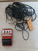 Front view of DOD FX55C Supra Distortion pedal with cable