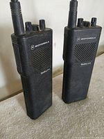 Front view of both Motorola Radius 250 radios standing upright