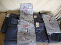 overview of packaged shirts and folded trousers