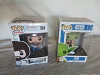 Front view of both boxed Funko Pop! figures