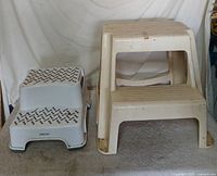 Both plastic step stools side by side