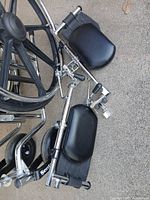 Overall view of wheelchair and detached leg rests
