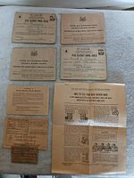 All seven pieces laid out: two ration books, instruction sheet, message card, identification card, mileage ration card, ration stamp sheet
