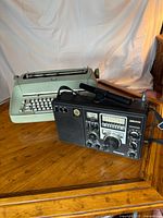 Panasonic RF-2200 radio and IBM typewriter on table