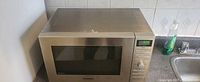 Front view of Panasonic stainless microwave on countertop