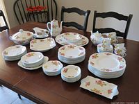 Overall view of complete Shelley dinnerware set on table