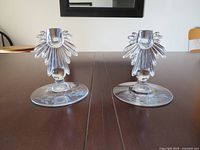 Frontal view of both glass candle holders showing overall design
