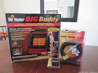 Front of Big Buddy heater box, hose and filter visible