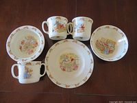 All six Bunnykins pieces laid flat for identification