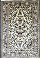 Full overhead view of entire Kashan rug showing design and borders