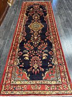 Full view of runner rug showing field and borders