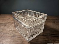 Full view of assembled clear glass ashtray showing both pieces together