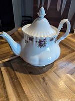 Full view of Royal Albert Sweet Violets teapot showing shape, pattern and handles