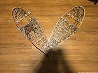 Full view of both snowshoes crossed