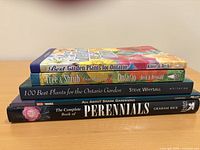 Stack of all five gardening books showing spines and one cover