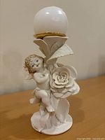 Full view of porcelain cherub candle holder