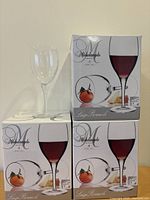 Three sealed Luigi Bormioli Michelangelo Masterpiece boxes with a loose glass displayed