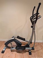 Right side view of Sunny SF-E3804 elliptical showing frame, pedals, flywheel cover, Sunny logo