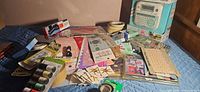 Wide view of lot showing label maker, tapes, Velcro, stencils, cord spools, stickers