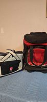Two cooler bags: Ogio wheeled cooler and LC soft cooler