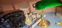 All items grouped: banker lamp, magnifier lamps, clamp lamp, Bushnell binoculars