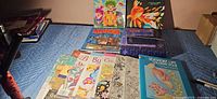 Full lot showing Zen garden box, purple sand packet and stack of coloring books