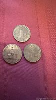 Three Bicentennial Kennedy half dollars reverse side