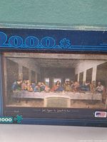 Front of sealed Buffalo Games puzzle box showing 2000-piece count and The Last Supper artwork