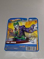 Front of sealed Hot Wheels The Joker blister pack