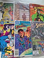 All six bagged comics displayed front covers visible