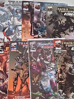 Group shot showing all nine Dreamwave Transformers comic books spread out