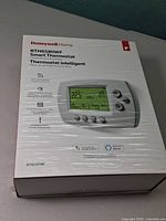 Sealed Honeywell RTH6580WF thermostat box front