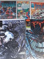 Five bagged Image Comics issues laid out—Stormwatch variants, WildC.A.T.S. #1, Warlords #1, Pitt #1