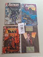 All four bagged comics displayed front covers