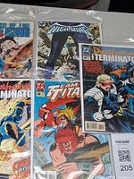 Group shot of all five bagged DC comics