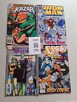All four comics laid out: Ka-Zar #4, Iron Man #225, She-Hulk #8, Cage #3 with MaxSold tag 206